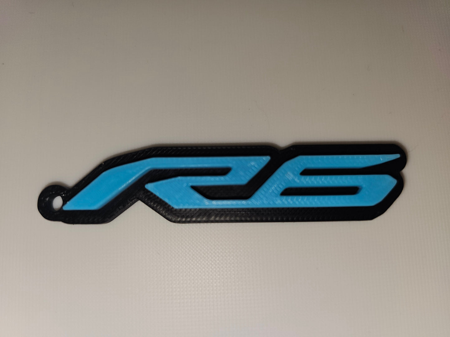Blue and black 'R6' logo on a light gray background